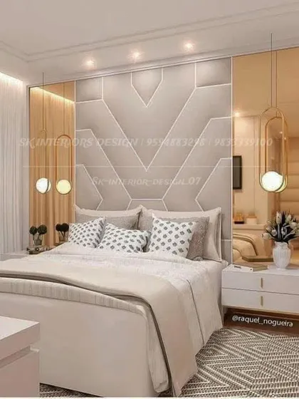 A luxurious bedroom with a geometric upholstered headboard and mirrored side panels. The hanging pendant lights on either side of the bed add a touch of modern glamour.