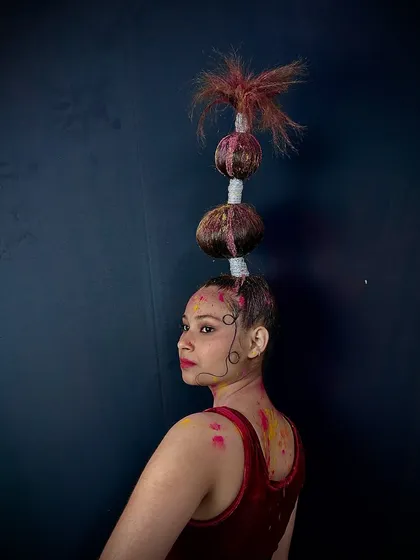 Unleash your creativity in our fantasy hairstyling workshops. This avant-garde look uses stacked bubble buns and color spray to create a gravity-defying style, perfect for editorial shoots or creative competitions.