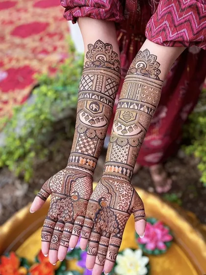 A full-coverage bridal design with a focus on geometric and architectural patterns. The structured layout gives it a very clean and sophisticated look, perfect for a modern bride who loves tradition.