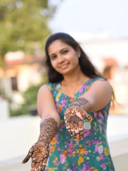 A clear shot of both hands, showcasing the symmetrical yet distinct designs on each palm.