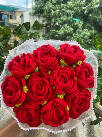 A classic red rose bouquet, wrapped in lace for a romantic touch.