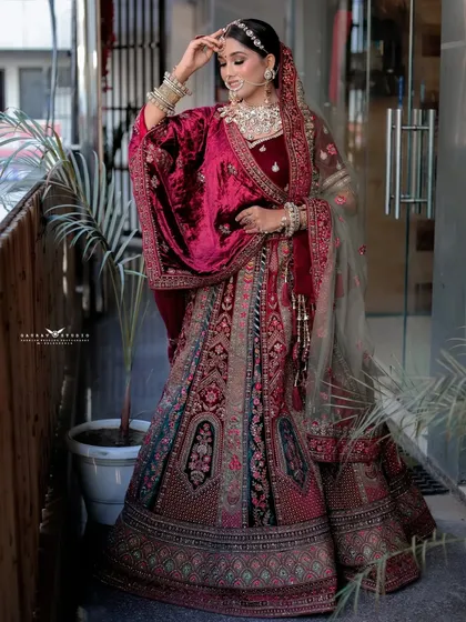 A final full-length pose, showing the bride adjusting her hair, creating a sense of elegance and movement.