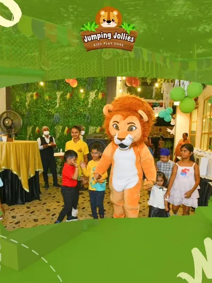 The lion mascot makes another appearance, creating a fun and lively atmosphere at a birthday event.
