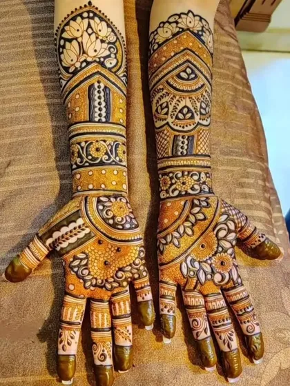 A mirror-image design on both arms with a prominent lotus motif at the top. The combination of bold outlines and delicate shading gives this design a lot of depth.