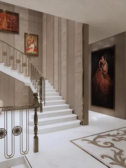 The grand staircase in the Frontier Bazaar concept is adorned with classical paintings and an ornate balustrade. It is designed not just for circulation but as a key element of the store's luxurious and theatrical aesthetic.