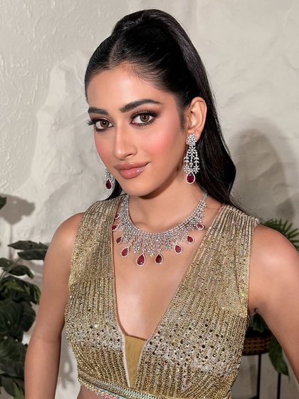 A beautiful three-quarter profile, showing off the flawless cheek highlight and contour. This look is crafted to catch the light beautifully from every angle.