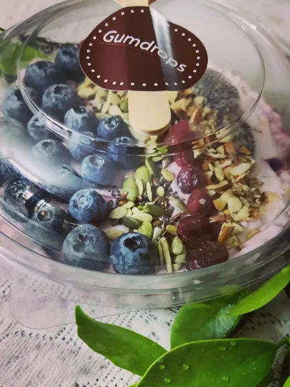 Start your day on a healthy note with our Berry Smoothie Bowl. A thick, creamy smoothie is topped with fresh blueberries, chia seeds, and a mix of nuts and seeds for a nutritious breakfast.
