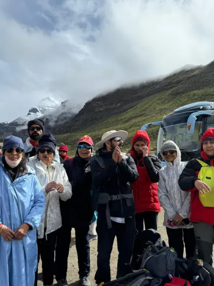The group gathered near our bus, with Kailash peeking through the clouds. Every glimpse of the holy mountain is a blessing that energizes us for the path ahead.