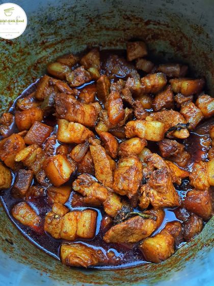 A pot of our delicious pork curry, slow-simmered to perfection. You can see the rich color and the tender pieces of pork, ready to be enjoyed.