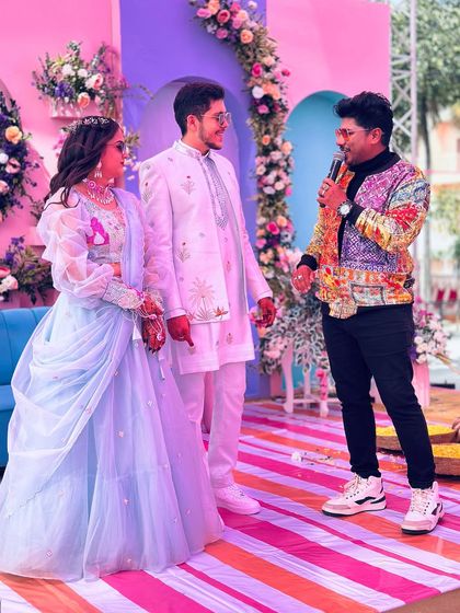 Interacting with the couple at their wedding carnival. The colorful, festive atmosphere is perfect for creating light-hearted and fun moments.