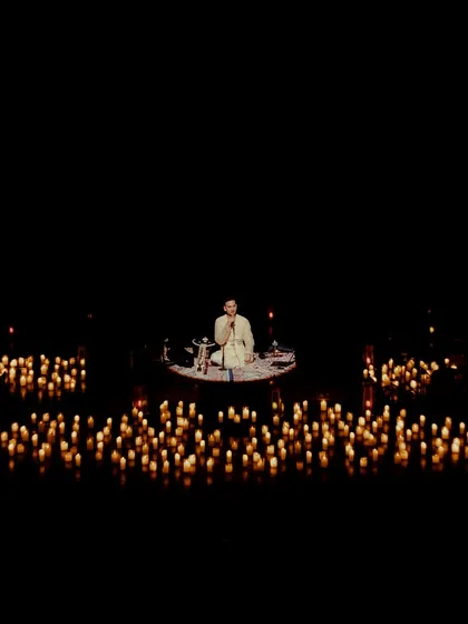 At the heart of every performance is a moment of stillness. Here, surrounded by candles at the Tagore Theatre, I begin with a meditation, creating a space for us to breathe, connect, and find calm together before the music begins.