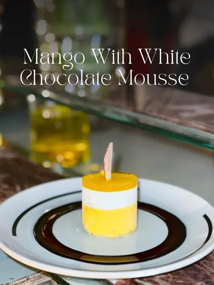 This is my Mango with White Chocolate Mousse dessert. It features beautiful layers of soft sponge, creamy mango mousse, and velvety white chocolate mousse, creating a light and tropical treat.