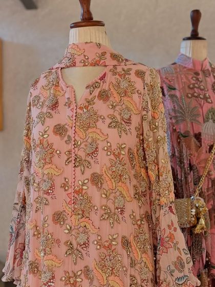 A closer look at a paisley printed kurta with delicate embroidery, a perfect blend of print and craft.