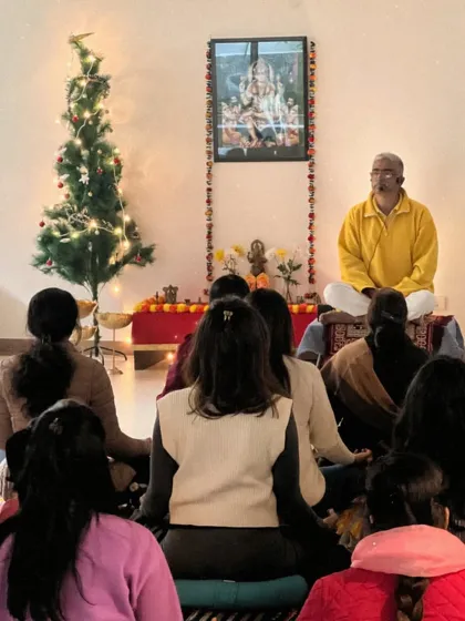 Leading the New Year's meditation in front of our altar. The festive decorations and collective energy create a very special and sacred atmosphere.