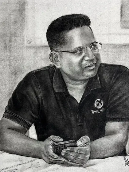 This commissioned charcoal drawing captures a candid, relaxed moment. My goal is always to make the portrait feel natural and full of personality, not just a copy of a photo.