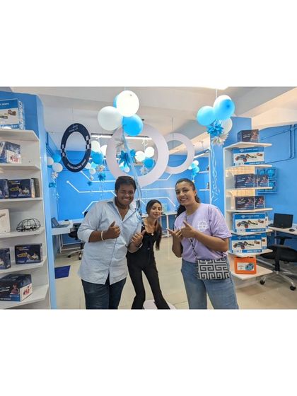 The happy team and partners at the Nagpur center launch, giving a thumbs-up for their new venture.