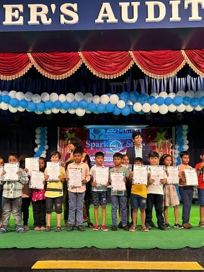 A proud moment for these young achievers at St. Peter's Auditorium in Ambedkar Nagar. After a powerful demo session, these students are holding their certificates, marking the first step on their journey to becoming 'Sparkling Stars'.