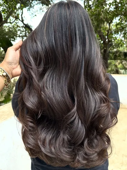 Her first hair color, and we went with a beautiful 'Cocoa Bean' shade. This is a great choice for a first-timer, as it's a subtle, rich brown that enhances natural hair color without being too dramatic.