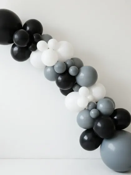 Sometimes, less is more. This elegant balloon garland in a monochrome palette of black, white, and grey was designed for a formal corporate networking event. It adds a touch of class and sophistication without overwhelming the space.