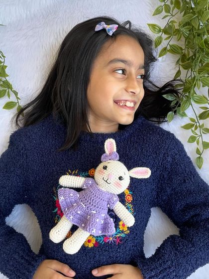 A lovely bunny in a purple dress with a custom initial "Q" on it. I made a similar one for my own daughter's birthday, and she absolutely adores it!