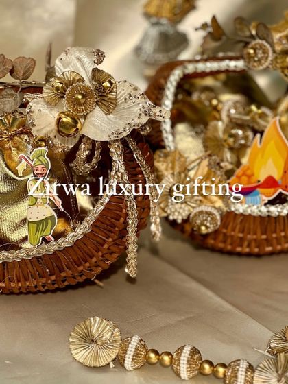 Two of my luxurious Lohri baskets, side by side. Both feature a golden theme with traditional cutouts, showcasing a consistent style for larger orders.