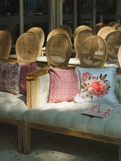 A close-up of the seating area, with custom-printed cushions and comfortable sofas, ensuring guests are comfortable and surrounded by beauty.