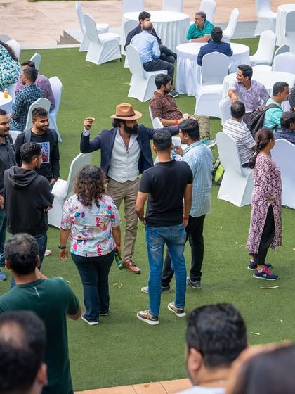 A lively networking session during a corporate annual day, showing the versatile use of our outdoor spaces.
