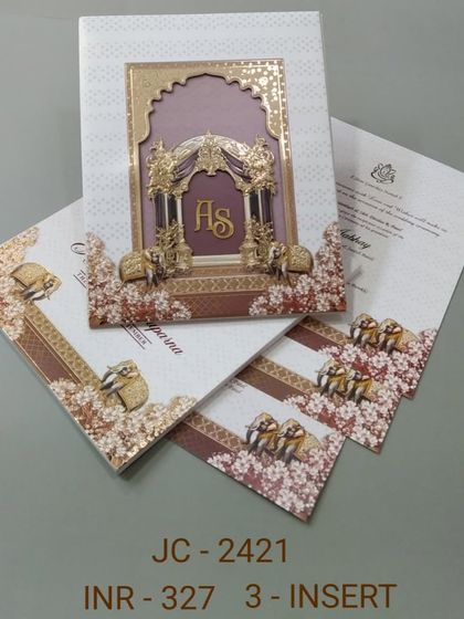 This card features an ornate 3D mandap structure with elephants, creating a sense of depth and luxury. The design is perfect for a traditional Hindu wedding and comes with three inserts.
