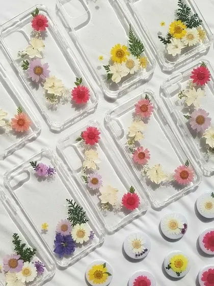 Your phone case can be a piece of art! I love creating these custom resin phone cases, embedding real dried and pressed flowers to make each one unique. This collection shows just a few of the floral designs I've made.