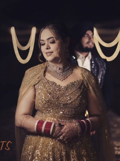 A moody and romantic night portrait of a couple at their reception. The soft lighting and the "Two Hearts, One Promise" text create a cinematic and heartfelt image.