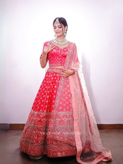 A confident pose in one of our most popular pink lehengas. This outfit helps create powerful and memorable bridal images.
