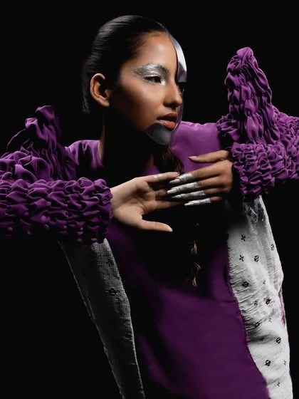 Another look from the "Metaverse" shoot, this time with a half-silver, half-natural face, creating a striking dual-identity concept.