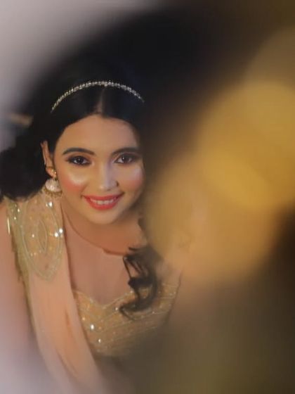 A dreamy, artistic shot of the peach lehenga, highlighting its soft color and delicate embroidery.