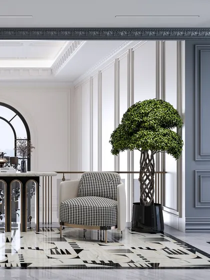 This view of the lobby highlights the classical wall paneling and the contrast between the modern furniture and traditional architectural elements.
