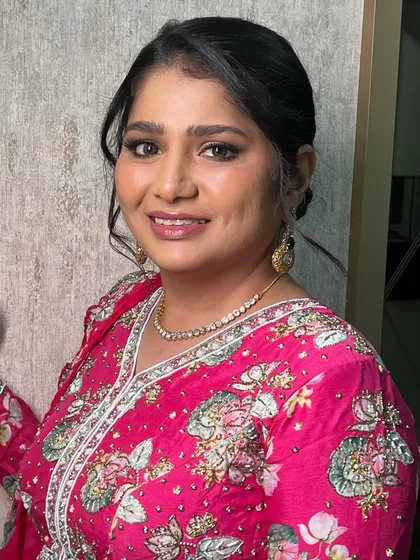A bright, happy smile from this gorgeous client. Her smokey eye and glowing skin make her look and feel ready to celebrate all night long.