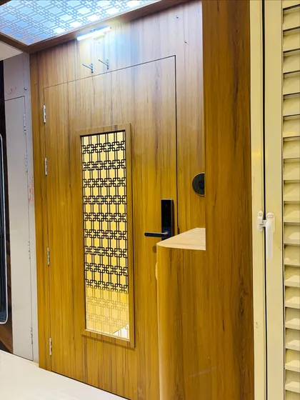 A side view showing the depth of the door frame and the overhead lighting.