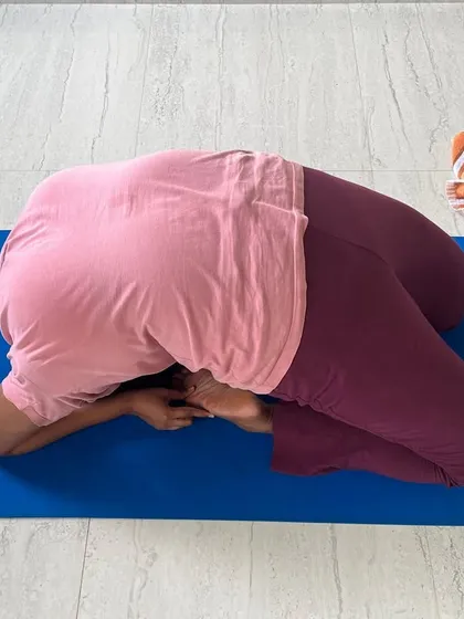 A student in the final expression of Kapotasana. This deep backbend is the culmination of dedicated practice, opening the heart center and improving spinal mobility.