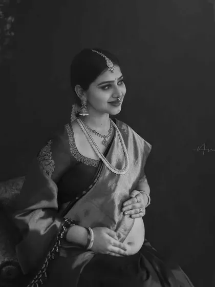 A black and white version of a traditional portrait, which brings a different mood and focus. The monochrome edit emphasizes the textures, light, and emotion, creating a classic, fine art feel.