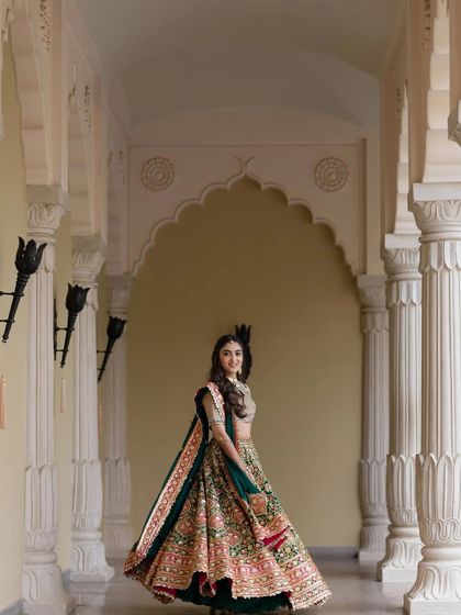 The bride twirling in her carnival lehenga, creating a beautiful and dynamic shot.