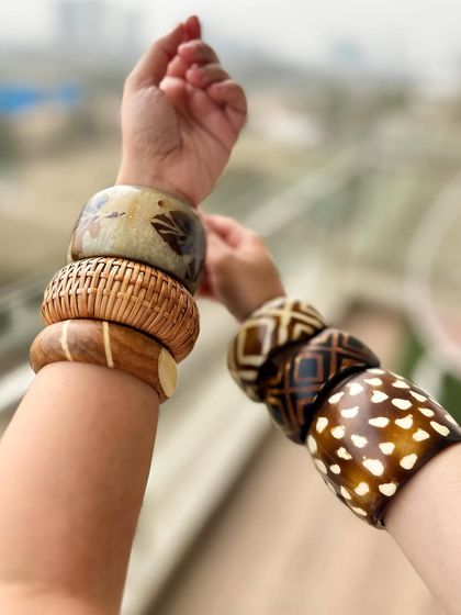 Another angle of my bangle stack. Mixing different patterns, textures, and widths creates a visually interesting and personalized accessory statement.