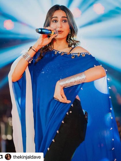 The magnificent Kinjal Dave on stage in our oxidised silver jewellery. For her performance, I styled her with a statement cuff and layered bracelets that are bold, edgy, and perfect for a high-energy show.