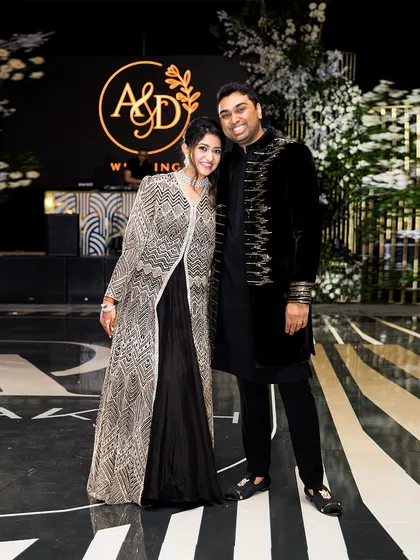 A monochrome dream for Devangi and Aakash's reception. Her sequined Ritika Mirchandani jacket and his embroidered Manish Malhotra sherwani were styled to create a look that was both coordinated and individually striking.