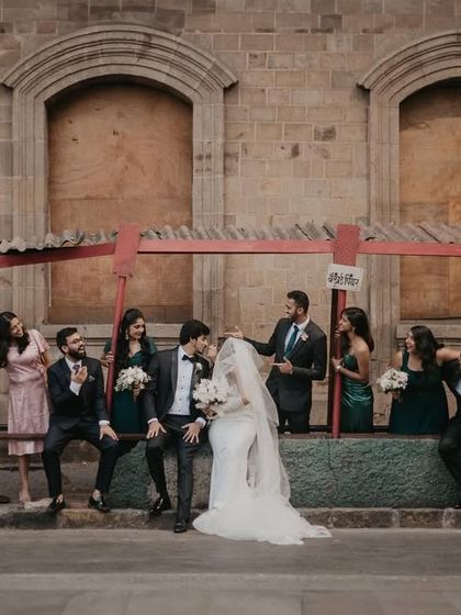 The entire wedding party having fun at a bus stop. I love creating these quirky, unposed group shots that show off the personality of the couple and their friends.