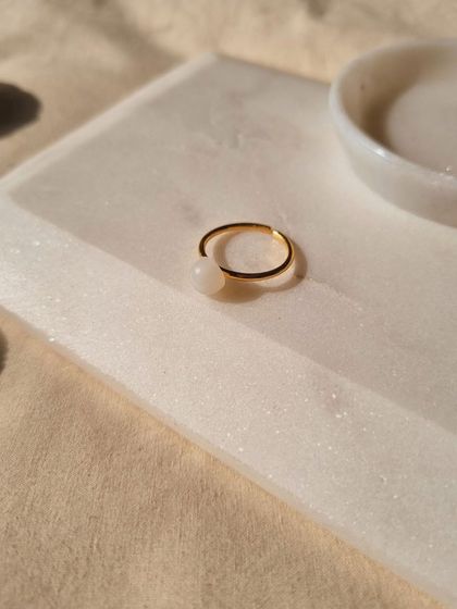Another shot of the White Moonstone Mood Ring, a simple and elegant piece for anyone who feels out of luck.