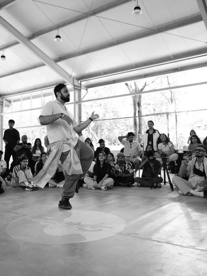 A black and white shot capturing the intensity of a battle at Spectra. The focus is sharp, the energy is high, and the passion is undeniable.