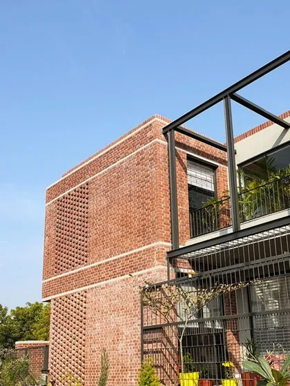 At the D-14 residence in Rohtak, exposed brick grounds the design in its context. Sourced from a local kiln, it shapes verandas and screens light, lending the home an earthy, rustic character that feels both timeless and modern.