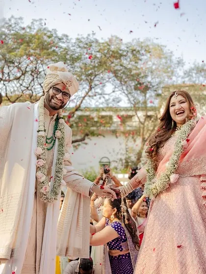 That just-married feeling! Capturing the explosion of joy, cheers, and a shower of petals during the varmala is one of my favorite parts of the day.
