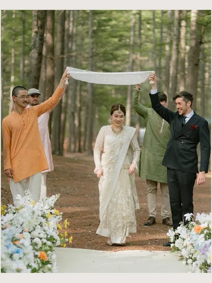 A bride's gentle entrance through the woods. I styled this ceremony with a simple white aisle runner and minimal floral decor, allowing the towering trees and natural surroundings to create a serene and sacred atmosphere.