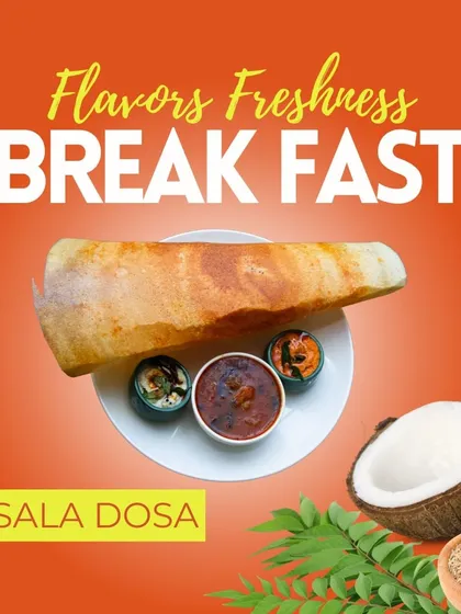 A closer look at our classic Masala Dosa. This crispy, golden-brown crepe is filled with a spiced potato mixture and served with fresh sambar and coconut chutney, a favorite at our HBR Layout restaurant.