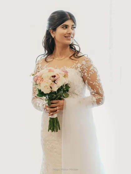 For the fairytale white wedding of your dreams. This look features flawless, glowing skin and soft, elegant waves, creating a timeless and ethereal bridal moment.